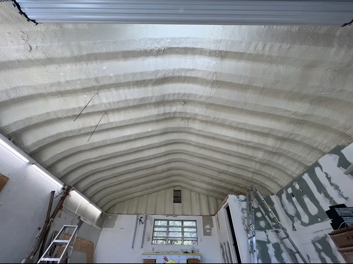 Spray polyurethane foam applied to the underside of a metal roof deck in Dodge City